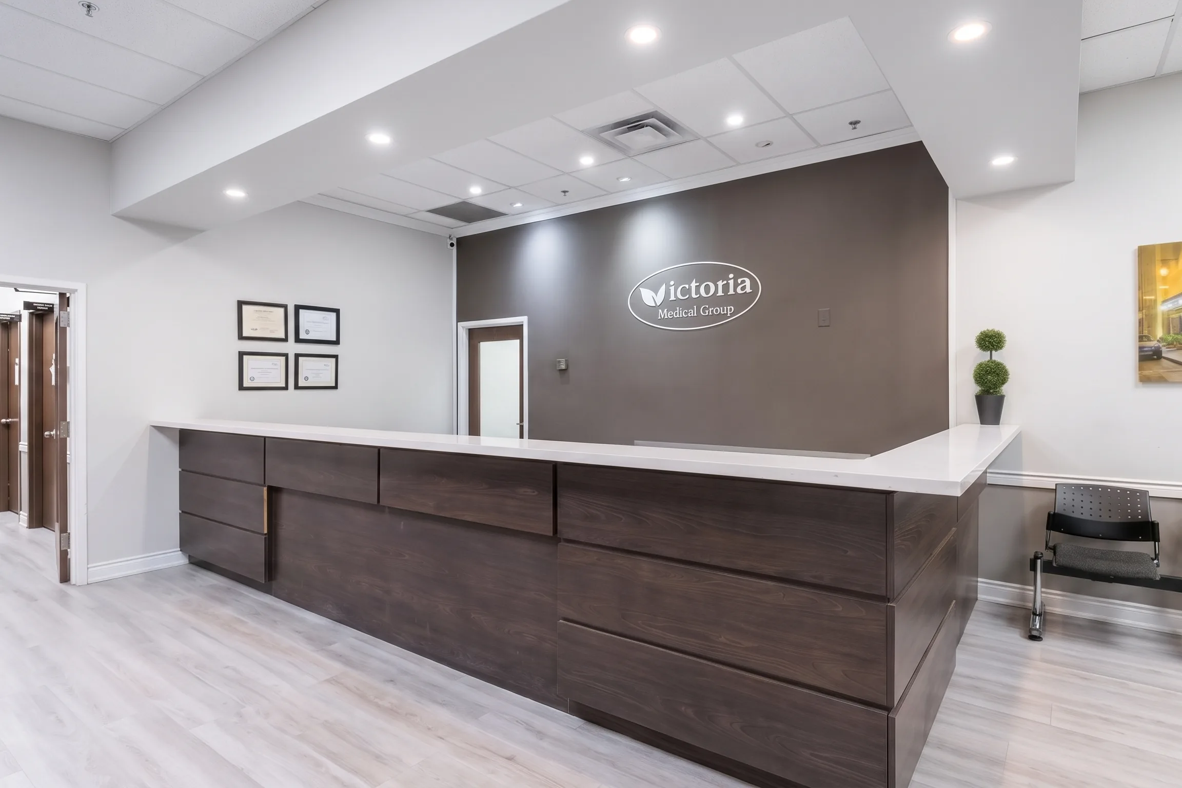 The reception desk with the Victoria Medical Group sign behind it