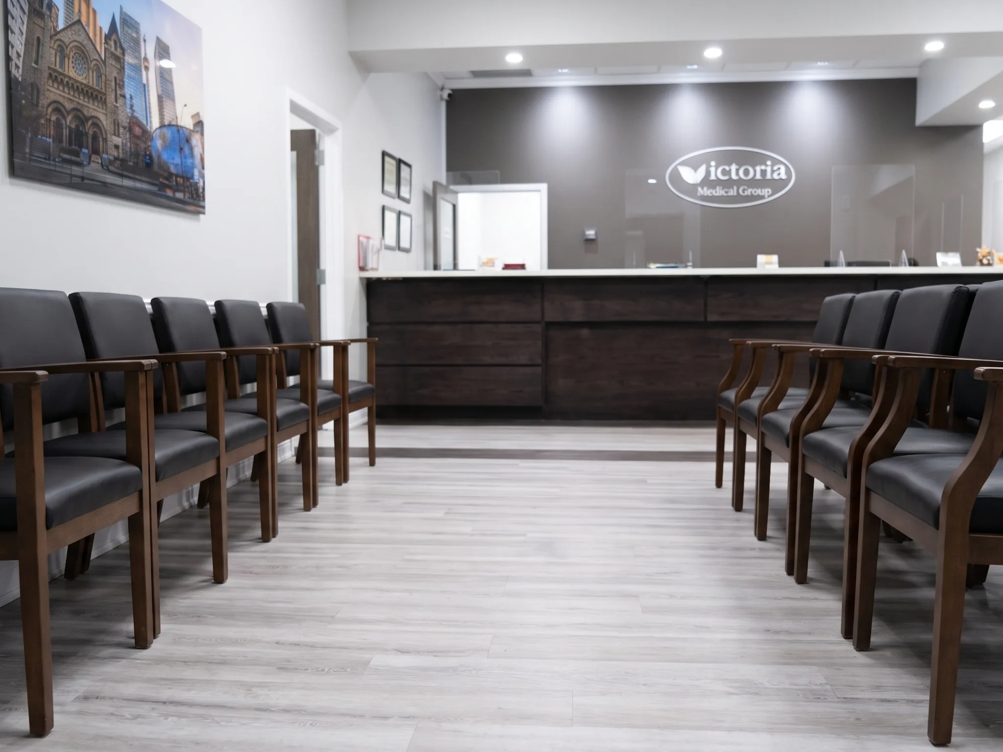 Rows of seating in the waiting room facing the reception desk